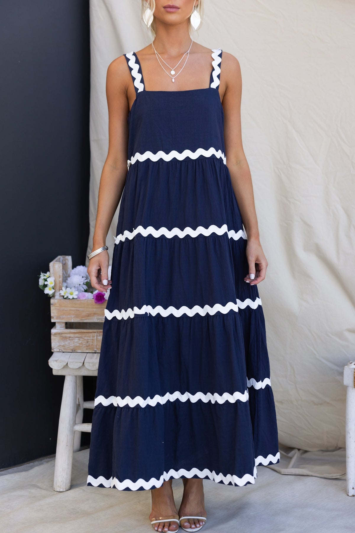 Navy Nori maxi dress with white rickrack trim, square neckline, and pockets, styled for a relaxed fit.