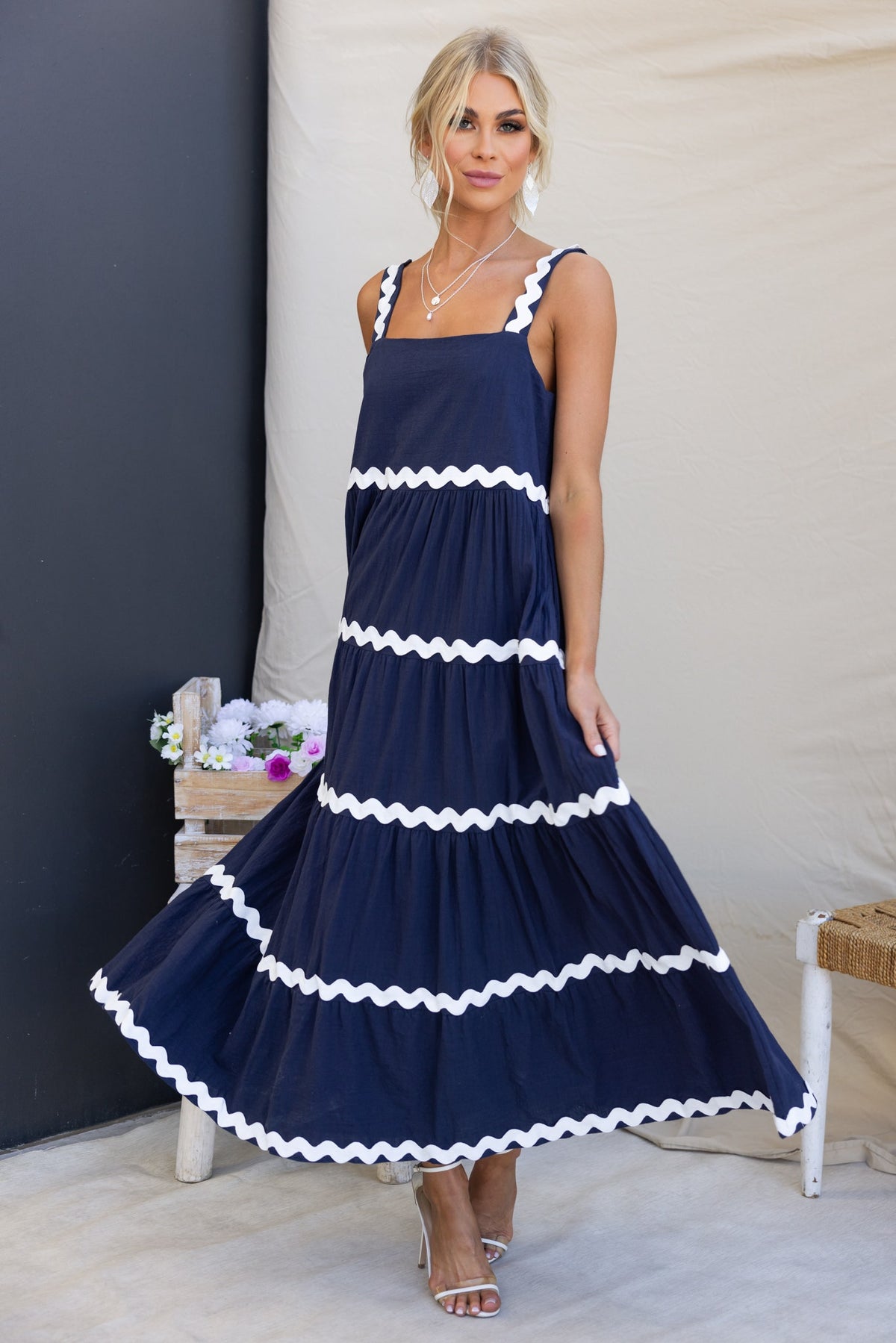 Navy Nori Maxi Dress with square neckline, ruffled trim, and pockets, featuring a relaxed fit and made from cotton.