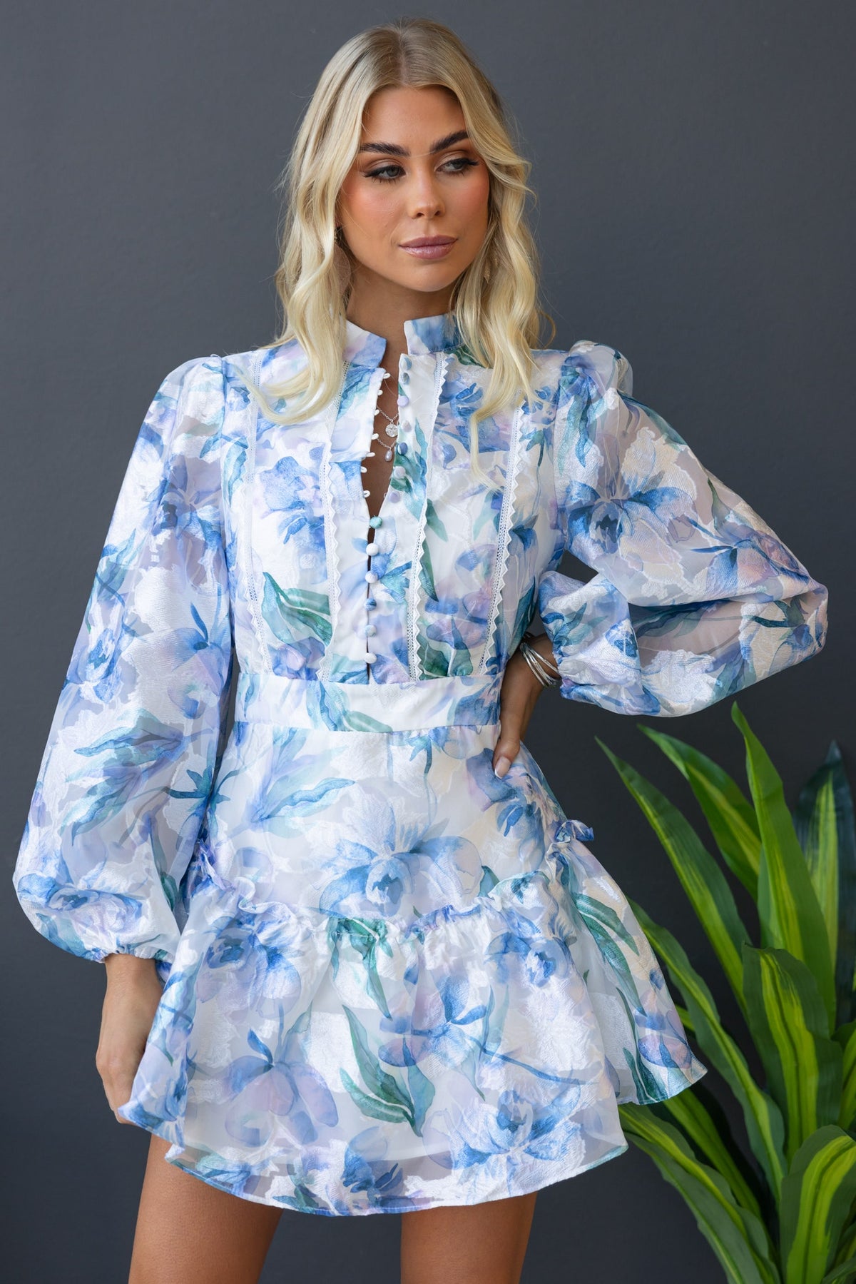 Wisteria Dress featuring a floral chiffon design, high neckline, and puff sleeves, perfect for stylish casual occasions.