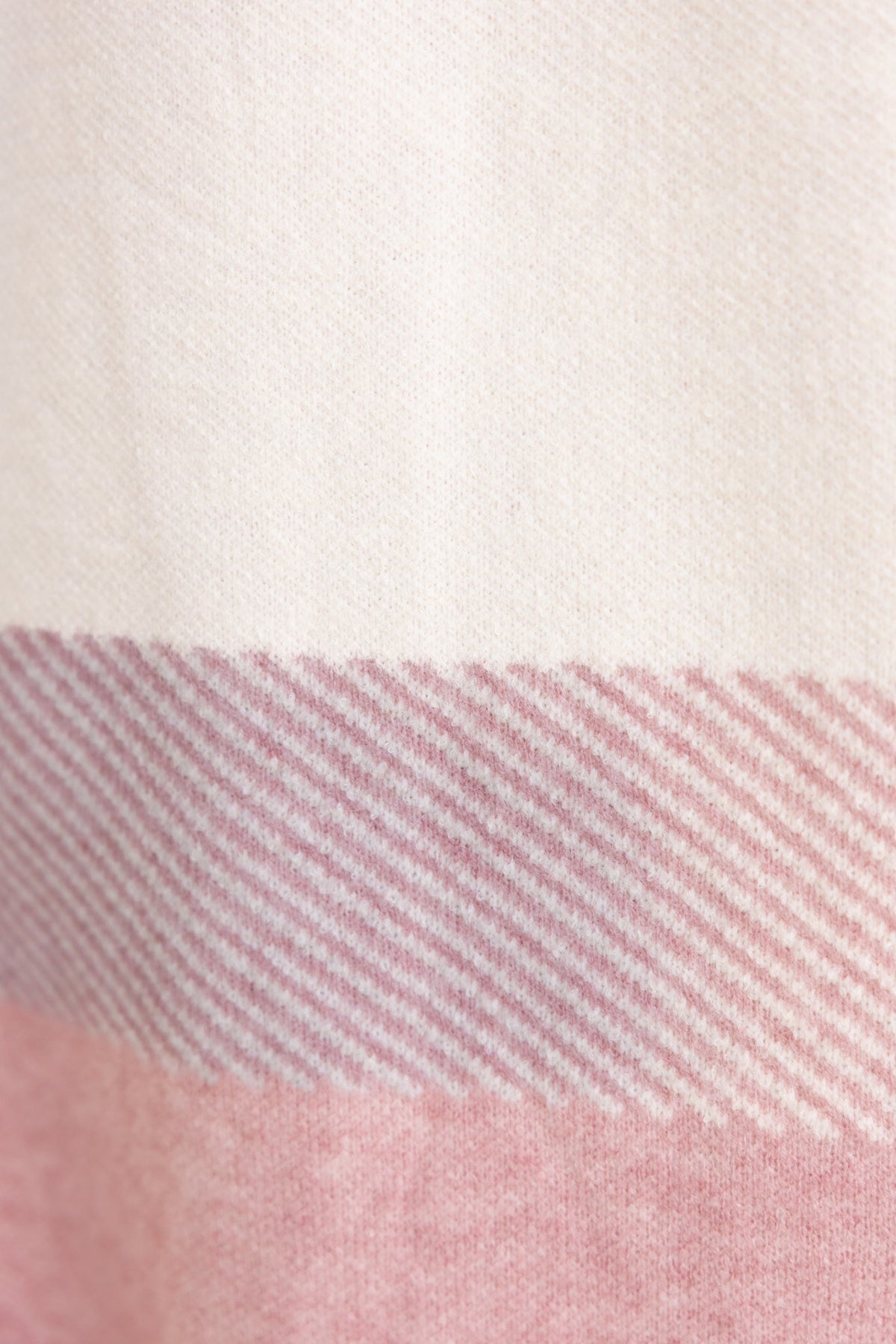 Close-up of Kellan Cardigan fabric showcasing a soft pink and cream striped pattern.