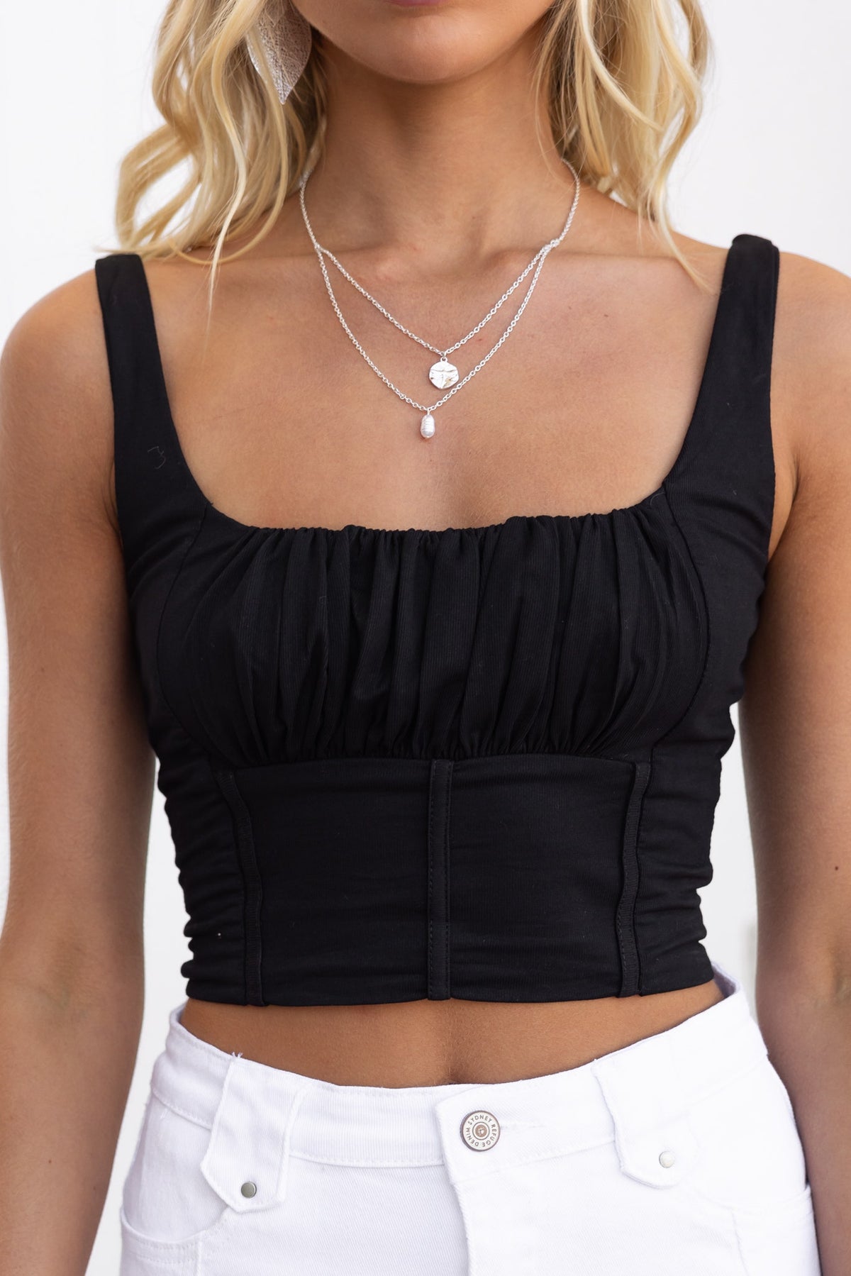Snalla Top: Black gathered crop top with faux boning and lightly ribbed stretch material.