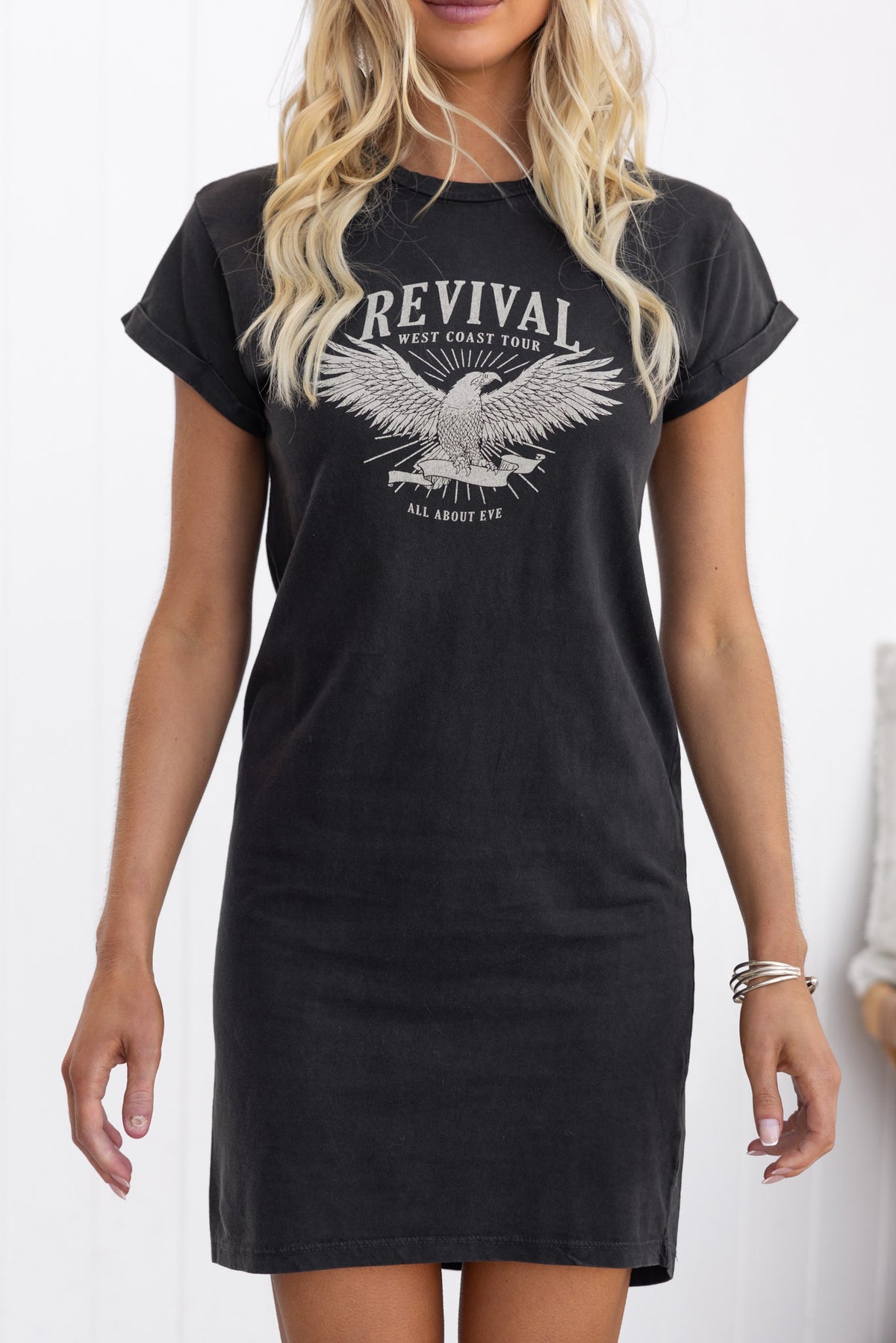 Marvin Dress in black with 'Revival West Coast Tour' graphic, featuring rolled sleeves and round neckline.