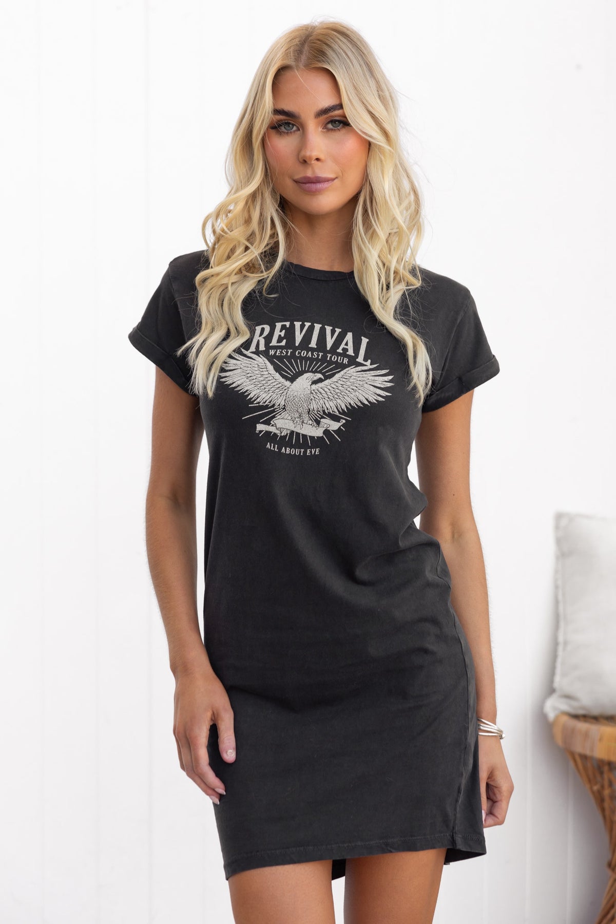 Marvin Dress in black with 'Revival' graphic print, featuring a round neckline and rolled sleeves, worn by a model.