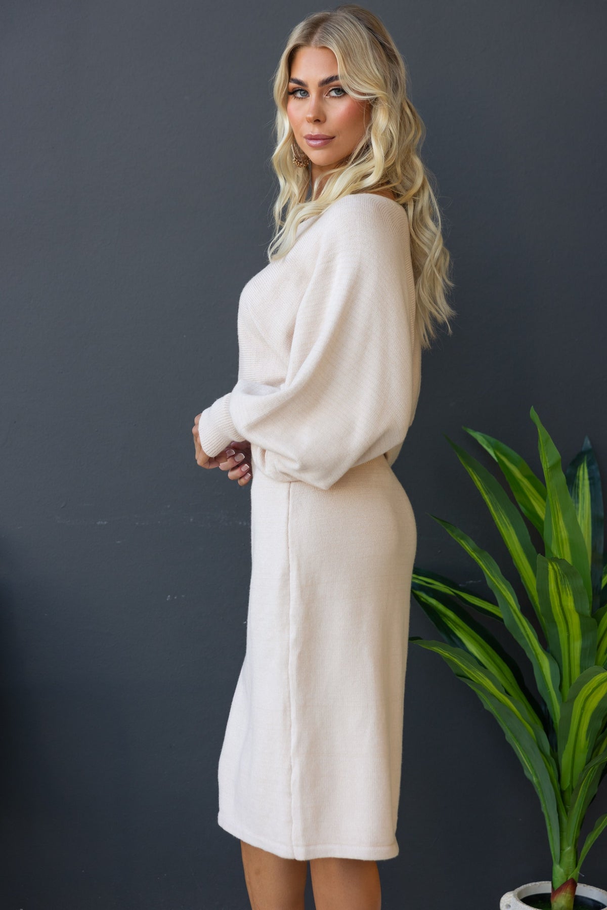 Model showcasing the Jadala Midi Dress with boat neckline and relaxed fit in soft, ribbed knit material.