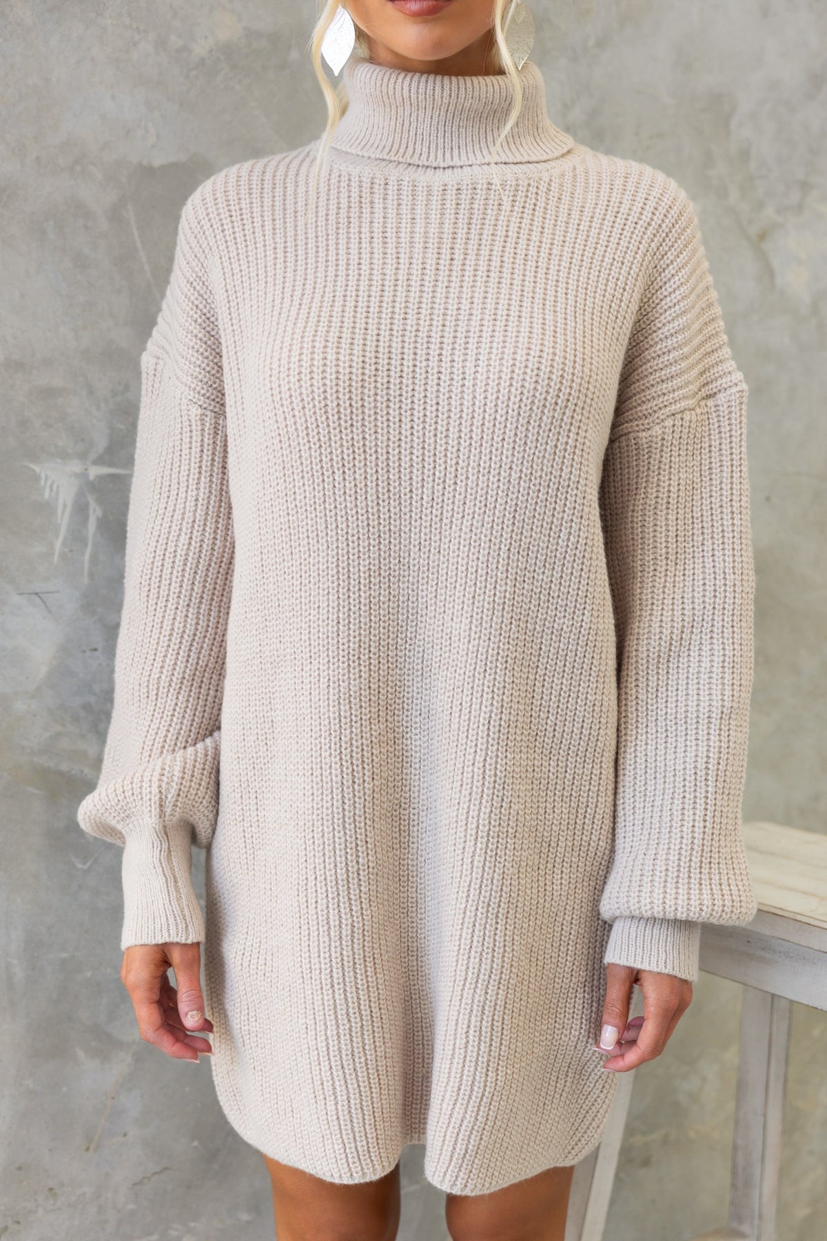 Whinnie Dress in light beige, featuring a turtle neckline and relaxed fit, perfect for casual wear.