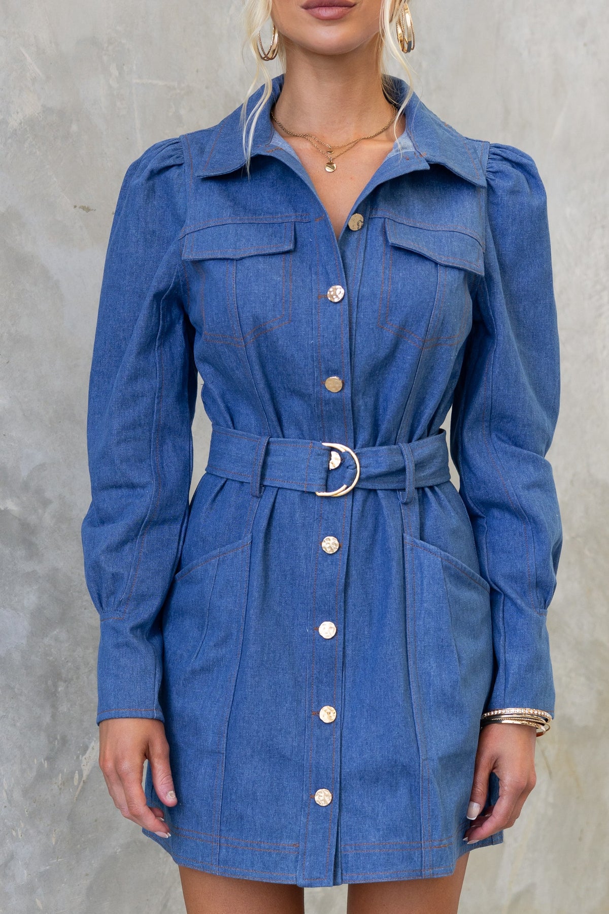 Childers denim dress featuring a button-up front, faux pockets, and a removable belt, perfect for casual outings.
