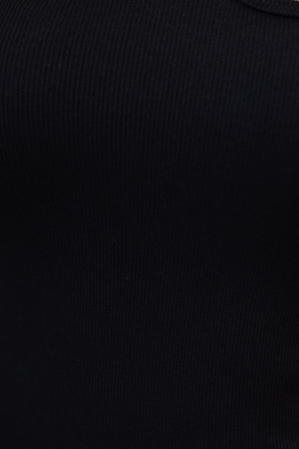 Close-up of Snalla Top in black, featuring lightly ribbed material with stretch and gathered bust design.