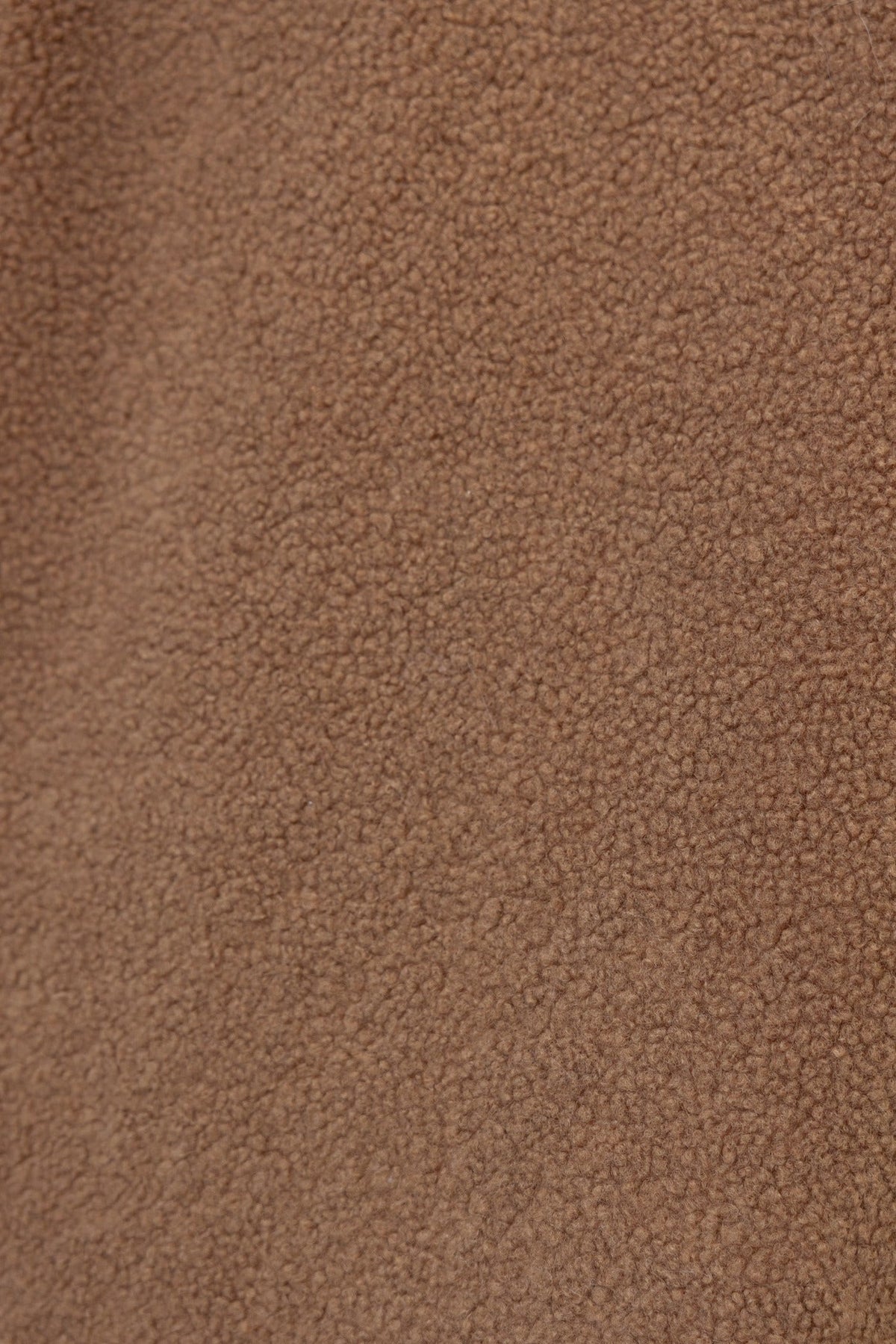 Close-up of soft teddy Borg material in a warm brown color, ideal for cozy outerwear like the Phala Coat.
