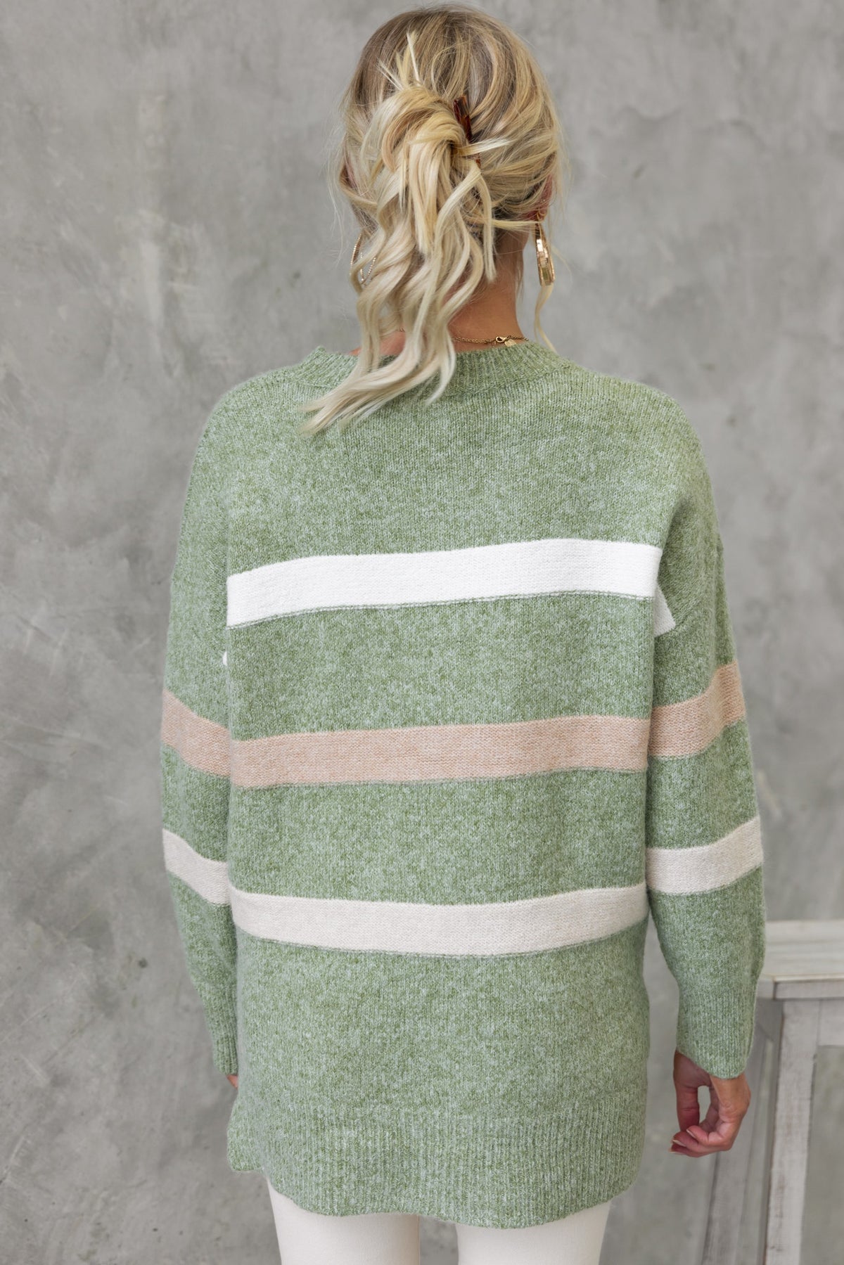 Lukki Jumper featuring a cozy knit design with green, white, and peach stripes, perfect for relaxed casual wear.