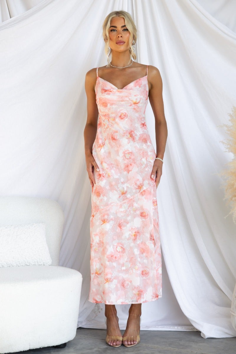 Model wearing a textured floral print Beaming Maxi Dress with cowl neckline and adjustable straps against a white backdrop.