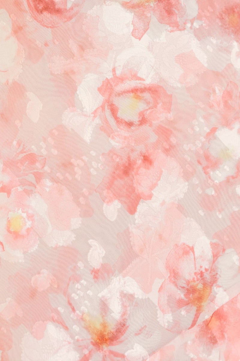 Close-up of textured floral print in soft pinks and whites, perfect for a feminine maxi dress design.