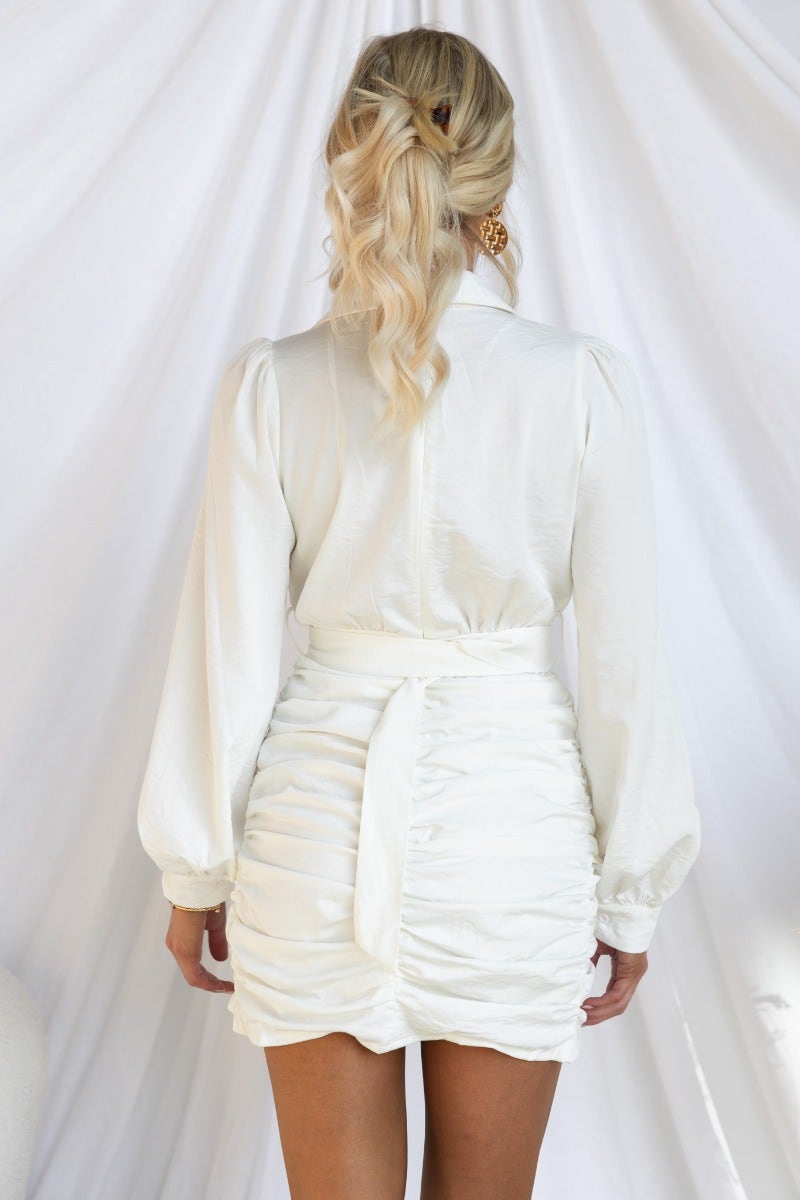 Back view of Ashwood Dress featuring a white collar, ruched detailing, and a removable fabric belt.