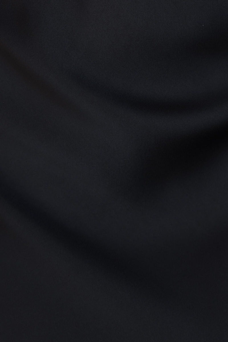 Close-up of black satin fabric showcasing its smooth texture and high-quality finish.