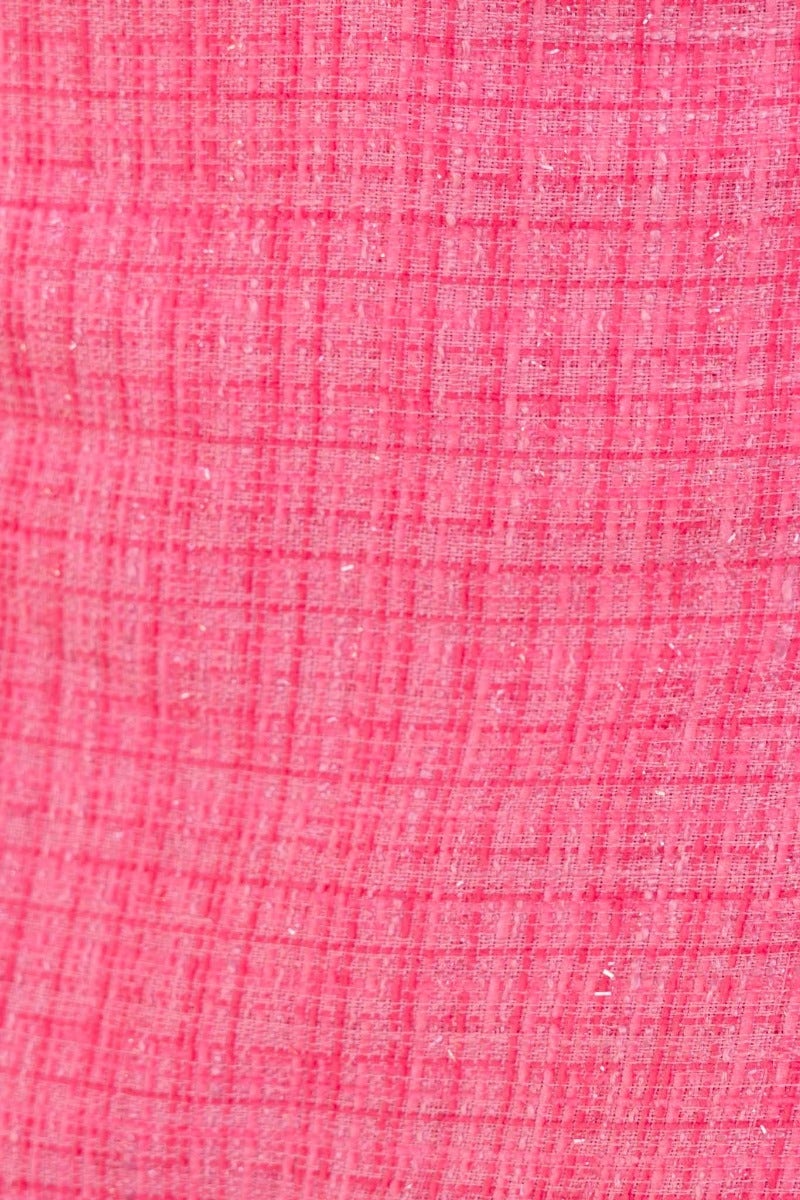 Close-up of textured pink fabric with a grid pattern, ideal for stylish garments like the Sophia Coat.