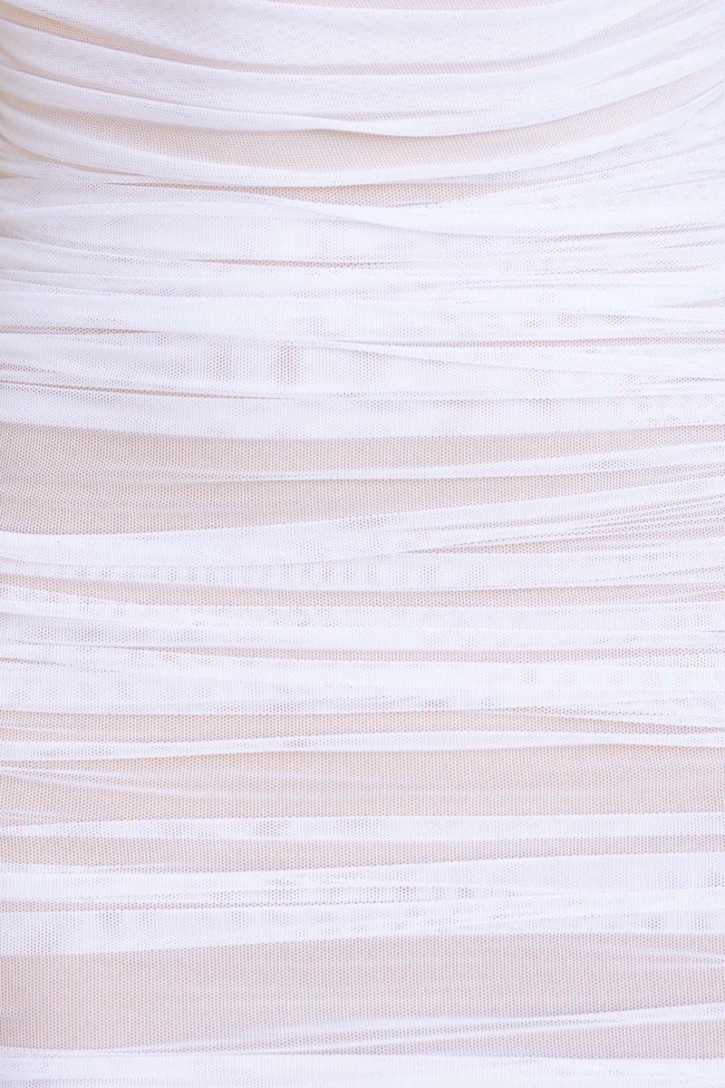 Close-up of Hilton Dress featuring a mesh overlay and ruching in soft white tones, highlighting its fitted design.