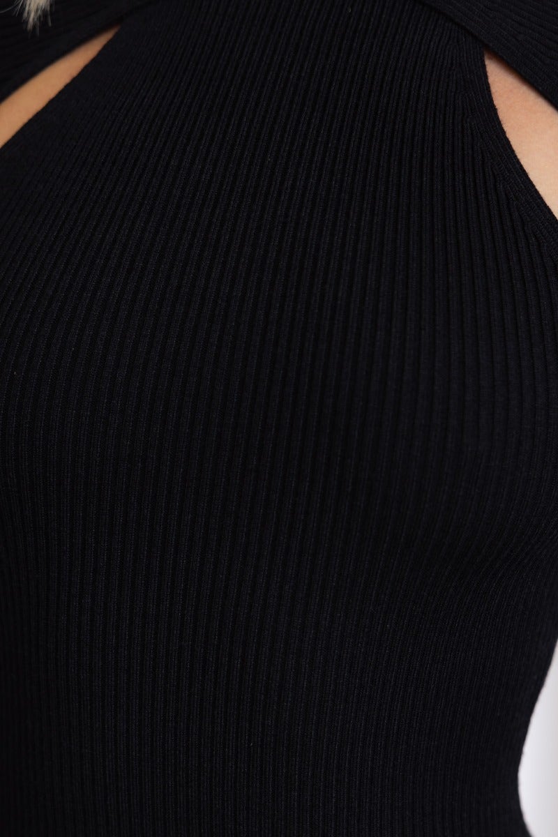 Close-up of black ribbed fabric featuring a high neckline and cut-out detail on the Arwen Maxi Dress.