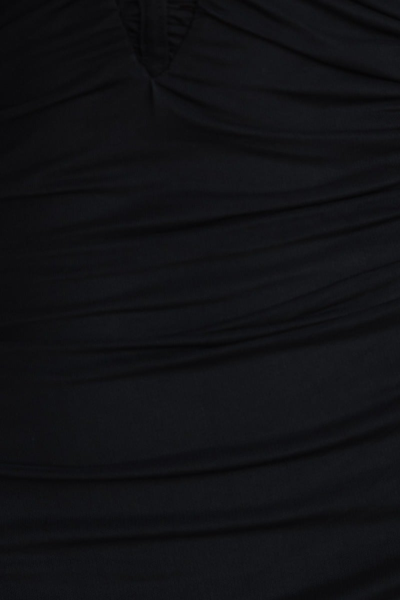 Close-up of black After Hours maxi dress fabric showcasing ruching and stretchy material.