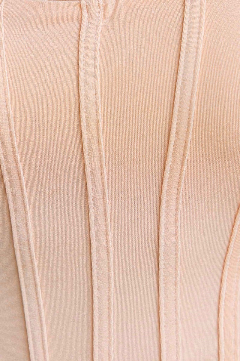 Close-up of Nixy Bodysuit fabric featuring soft, stretchy material with faux boning detail and vertical seam design.