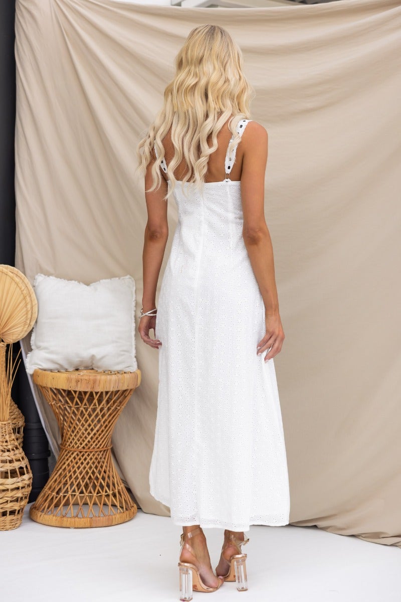 Back view of the Cottage Dreams Maxi Dress featuring adjustable straps and ribbon detailing.