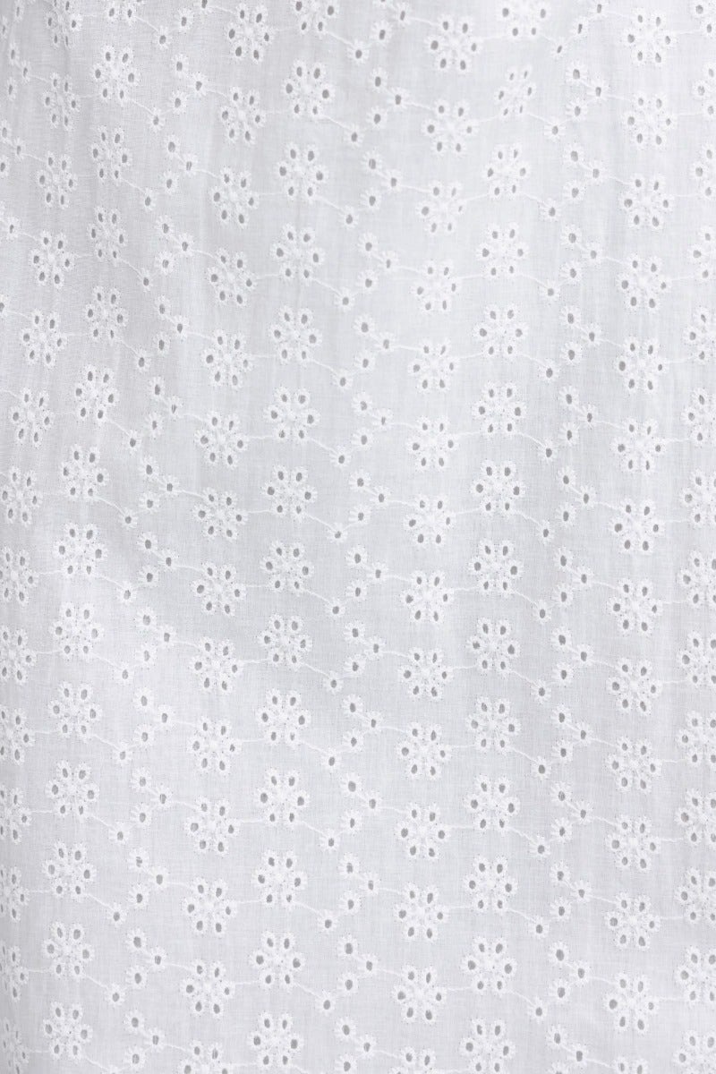Close-up of delicate anglaise fabric with floral eyelet pattern for Cottage Dreams Maxi Dress