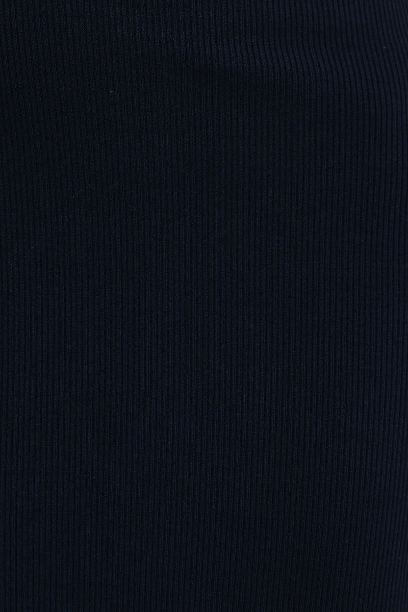 Close-up of black ribbed fabric texture, showcasing the stretch and quality of the material used in clothing.