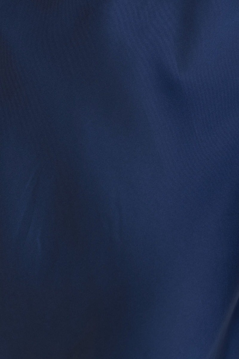 Close-up of navy fabric texture for Zadora Maxi Dress, showcasing its rich color and smooth finish.