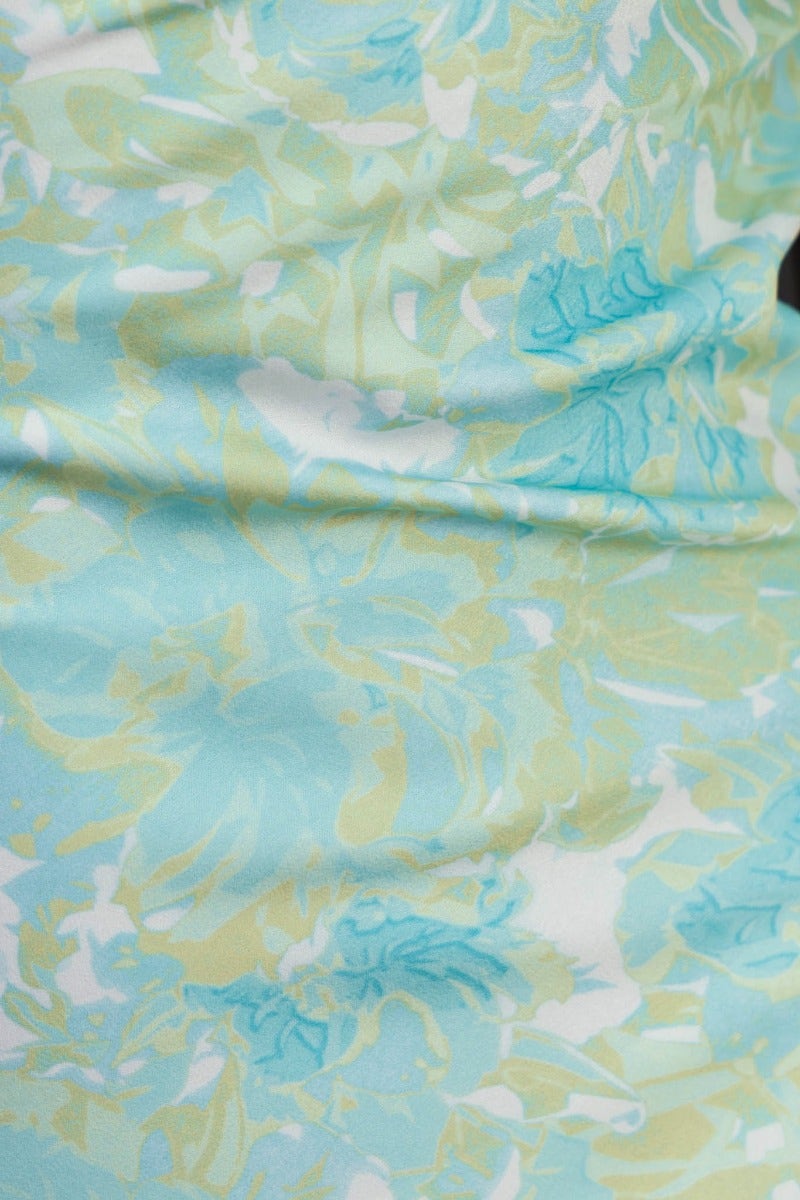 Close-up of the Jiah Maxi Dress fabric featuring a multi-colour floral pattern in shades of blue and yellow.