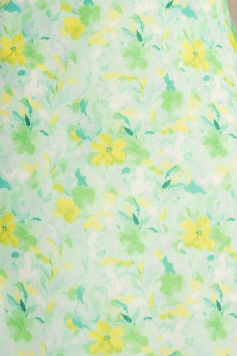 Floral print fabric in shades of yellow and green on a light background, ideal for a zesty midi dress.