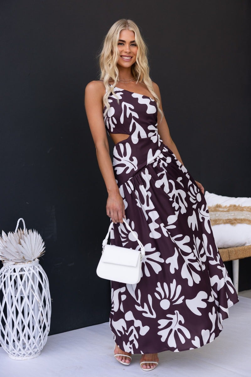 Floral print Ranier maxi dress with an elegant one-shoulder neckline and cut-out at the waist, model wearing size 6/XS.