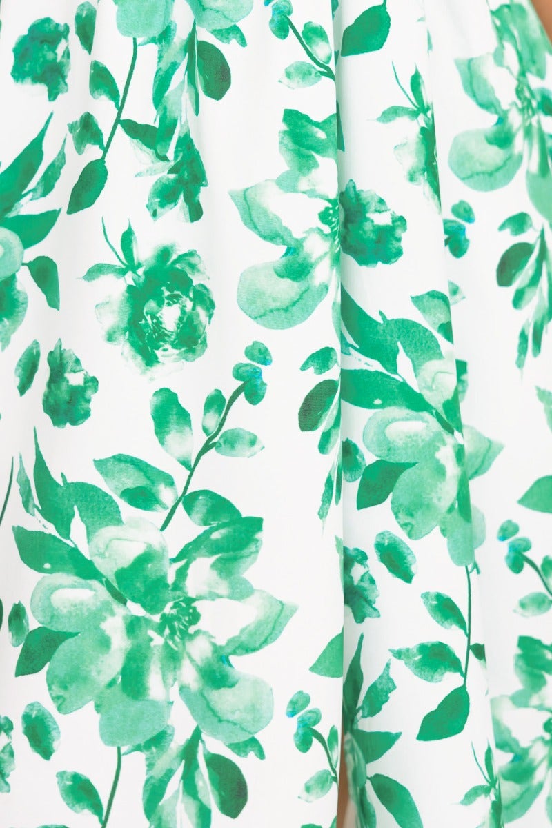 Floral print design in green on a white background, showcasing the fabric of the Quiet Days Midi Dress.