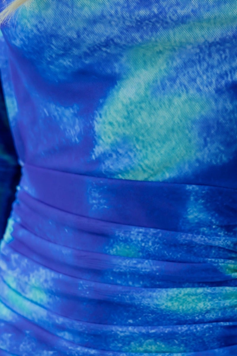 Close-up of Keziah Maxi Dress featuring vibrant blue and green fabric with ruching detail and a structured bodice.