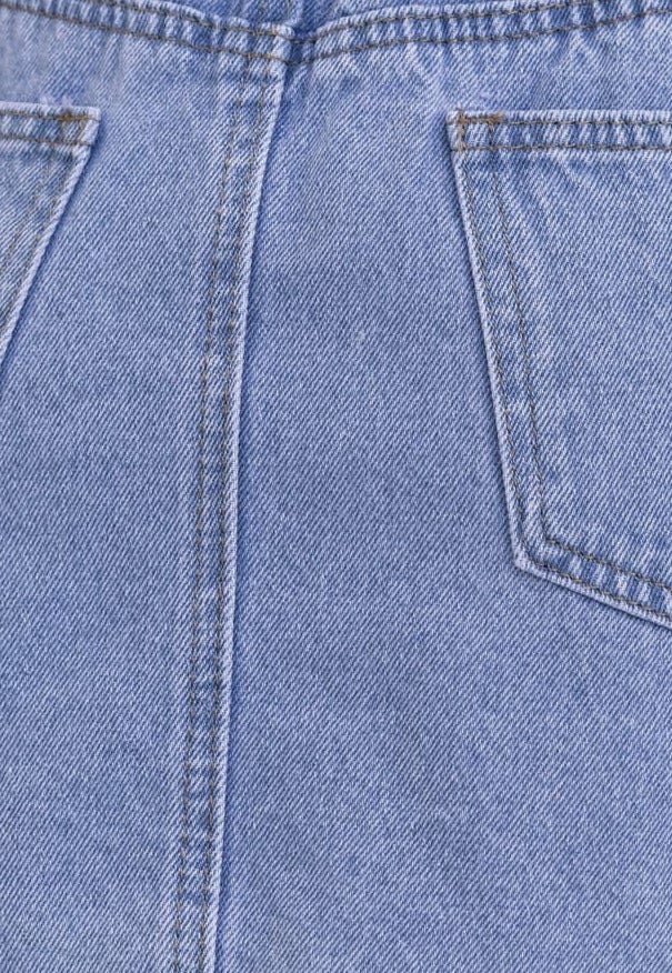 Close-up of Serona Denim Skirt showing back pockets and light blue denim fabric texture.