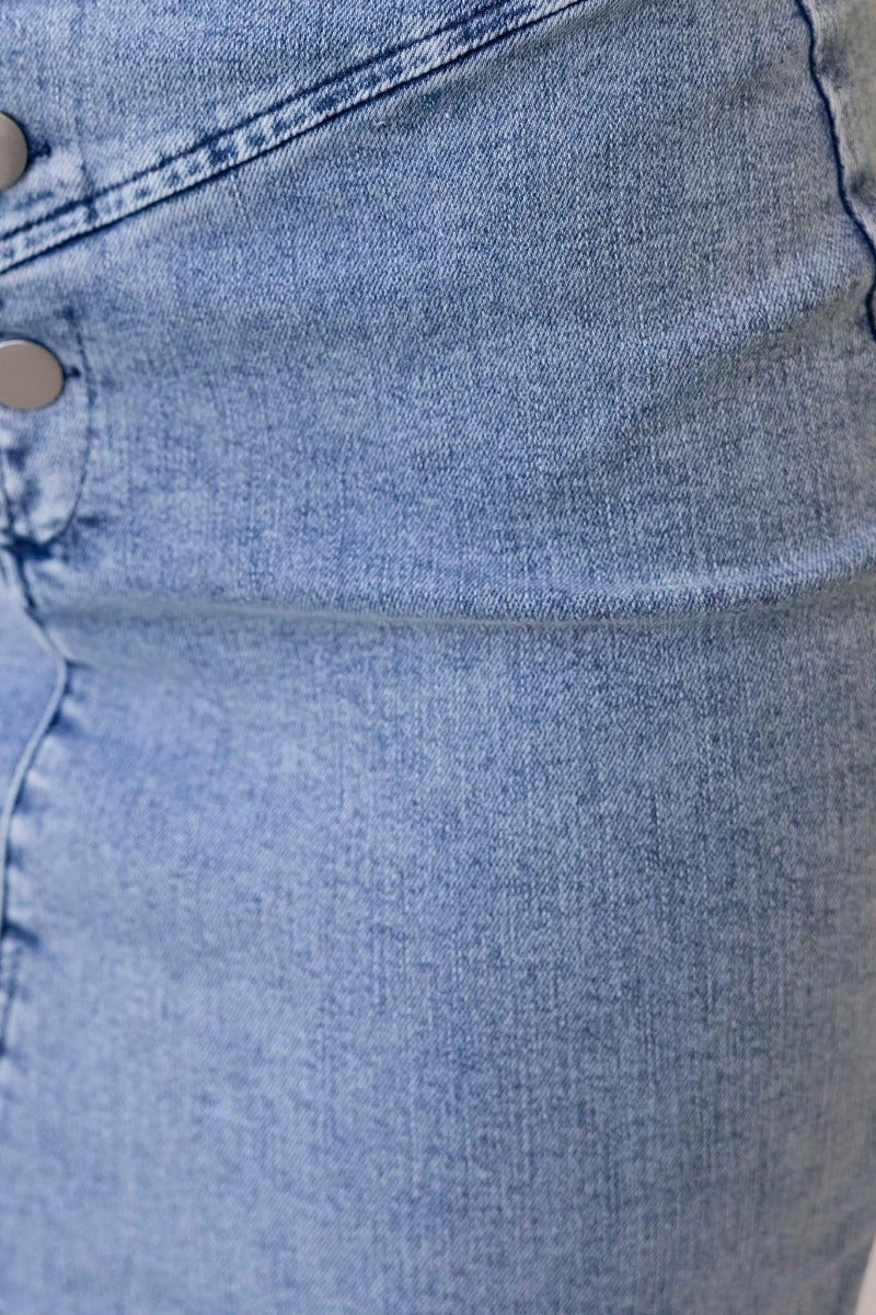 Close-up of Genevieve Top showing denim texture and button detail with a light wash finish.