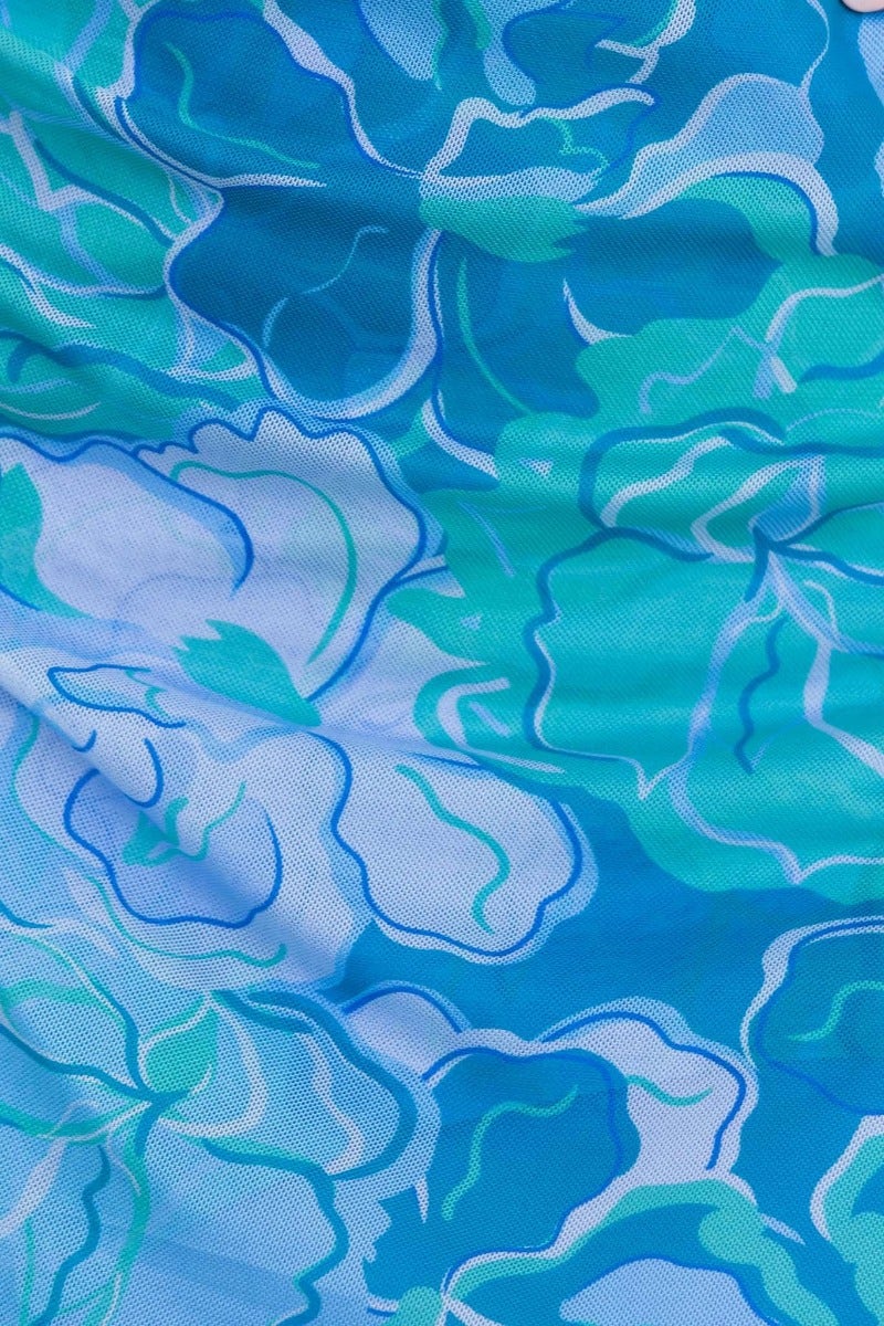 Close-up of floral multi-colour mesh fabric in blue and green, showcasing intricate print for Us Girls Midi Dress.
