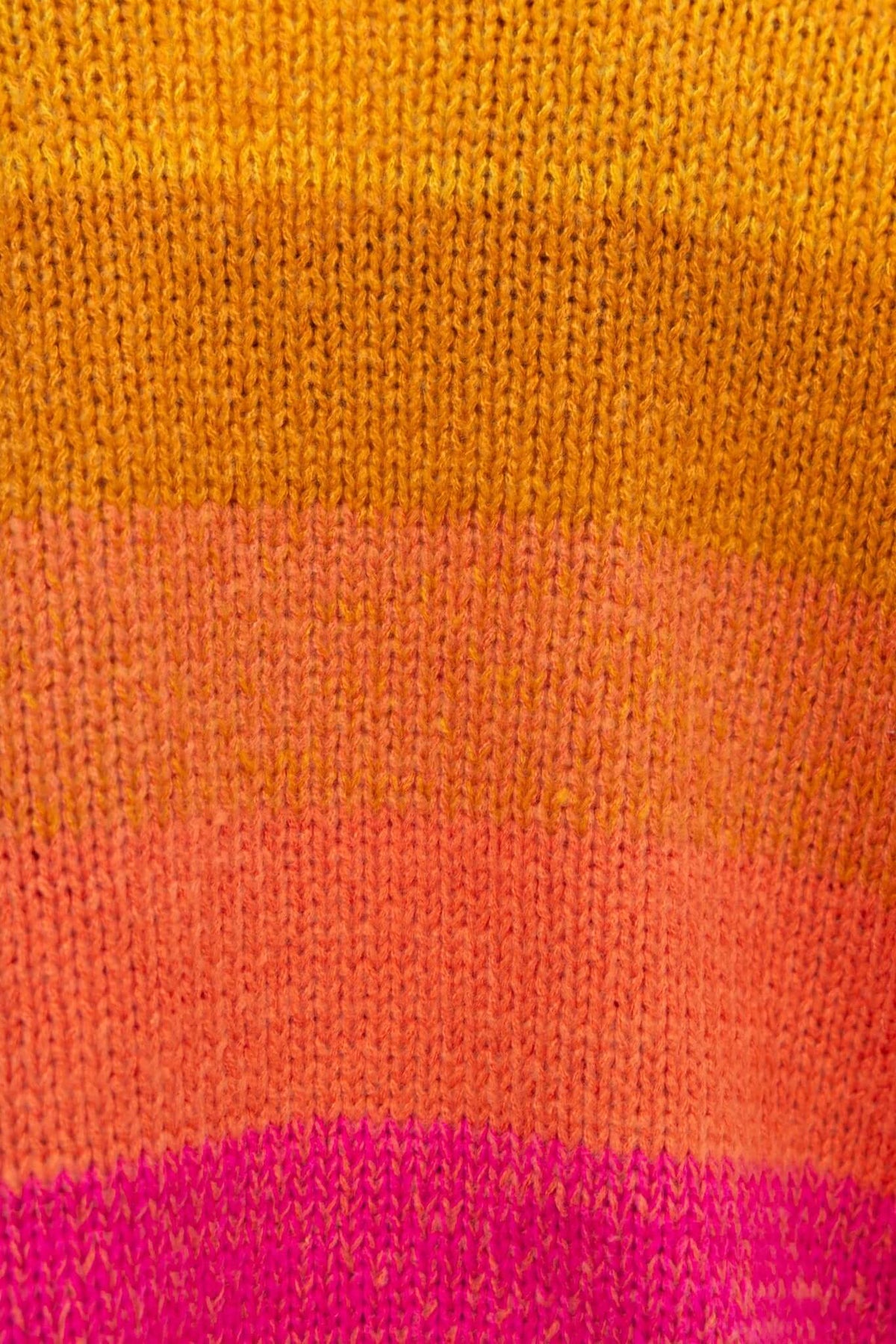 Close-up of Xylia Cardigan knit fabric featuring vibrant yellow, pink, and purple stripes.