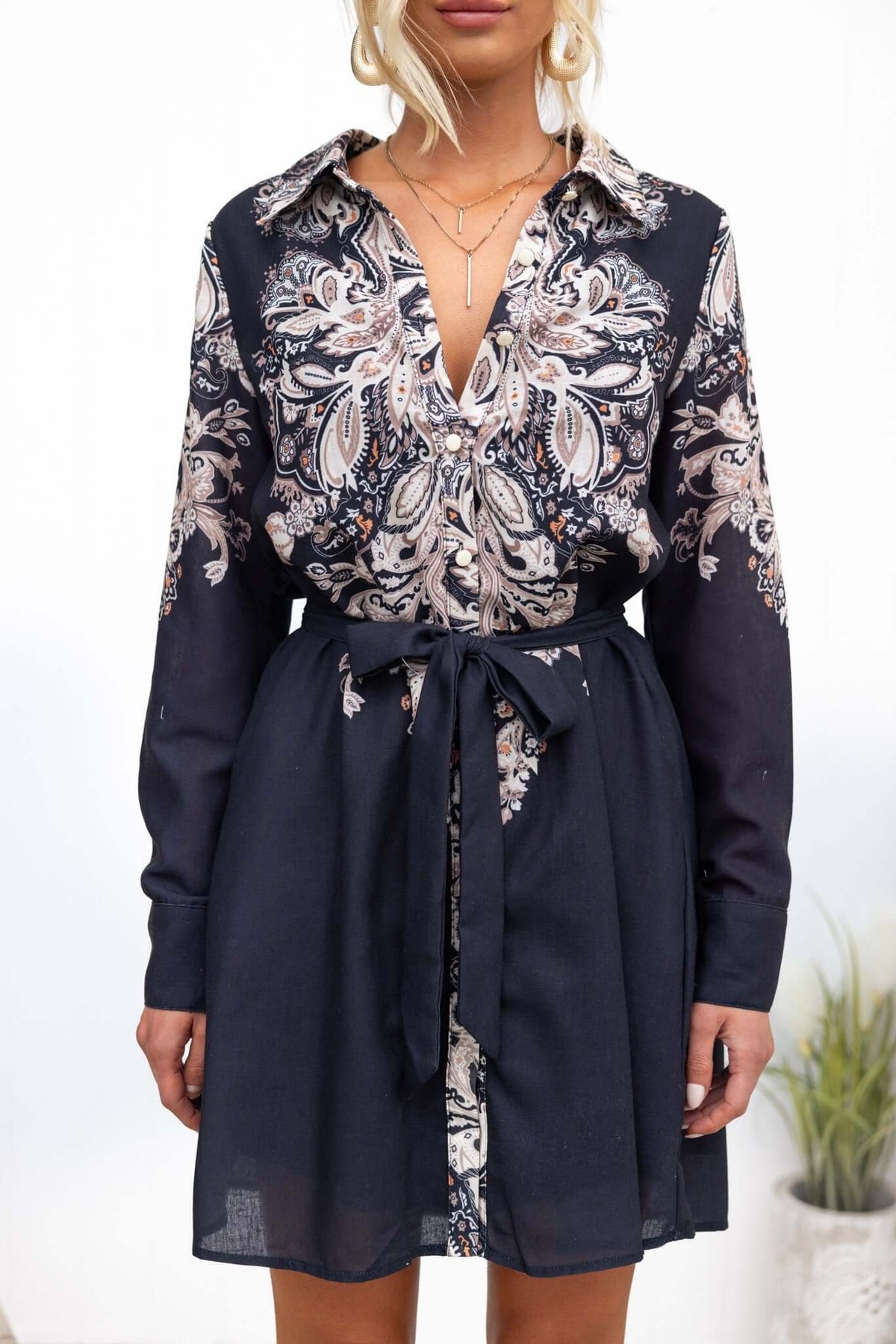 Channey Dress in black with floral print, button-up front, and removable tie, perfect for stylish casual wear.
