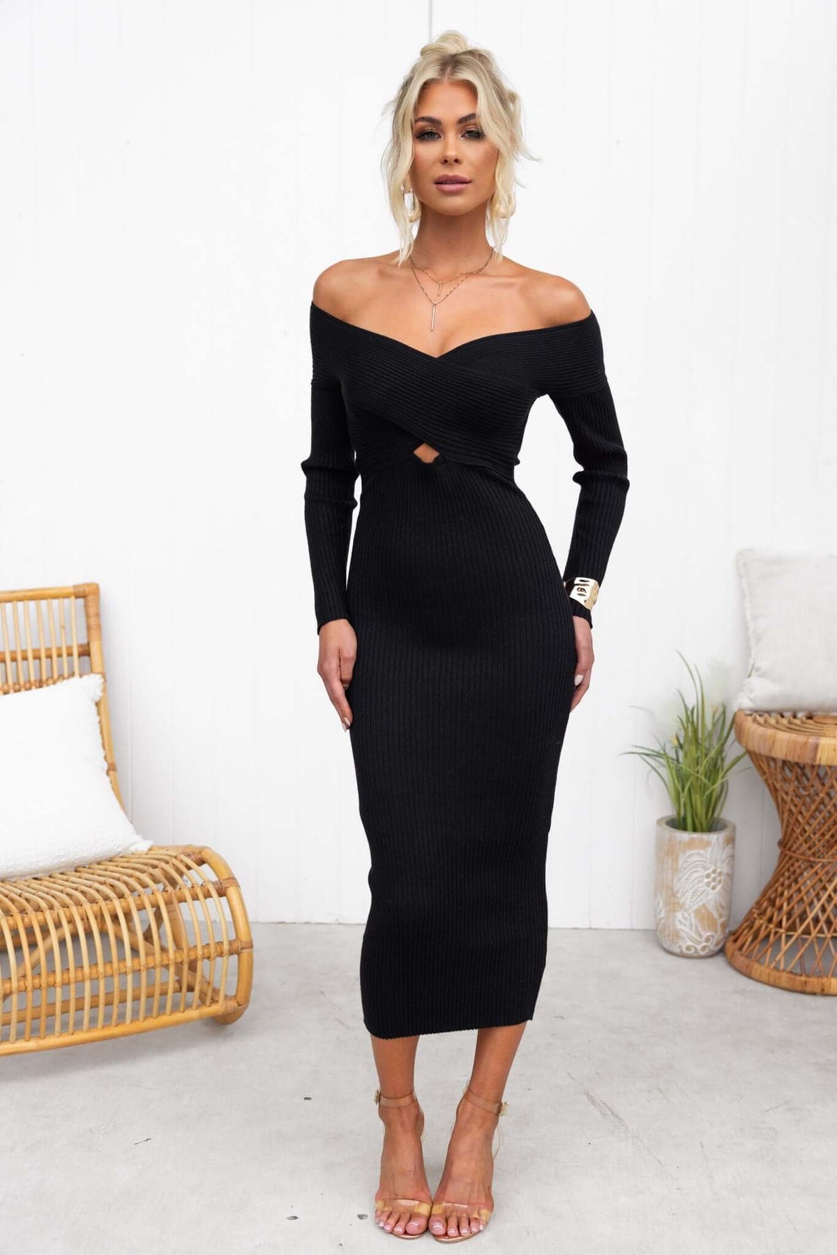 Cadia Midi Dress in black with off-shoulder design, ribbed knit material, and elegant silhouette.