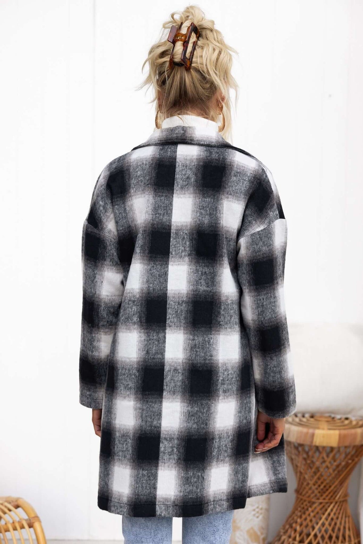 Back view of a stylish black and white plaid tiffin coat, perfect for casual wear and comfort.