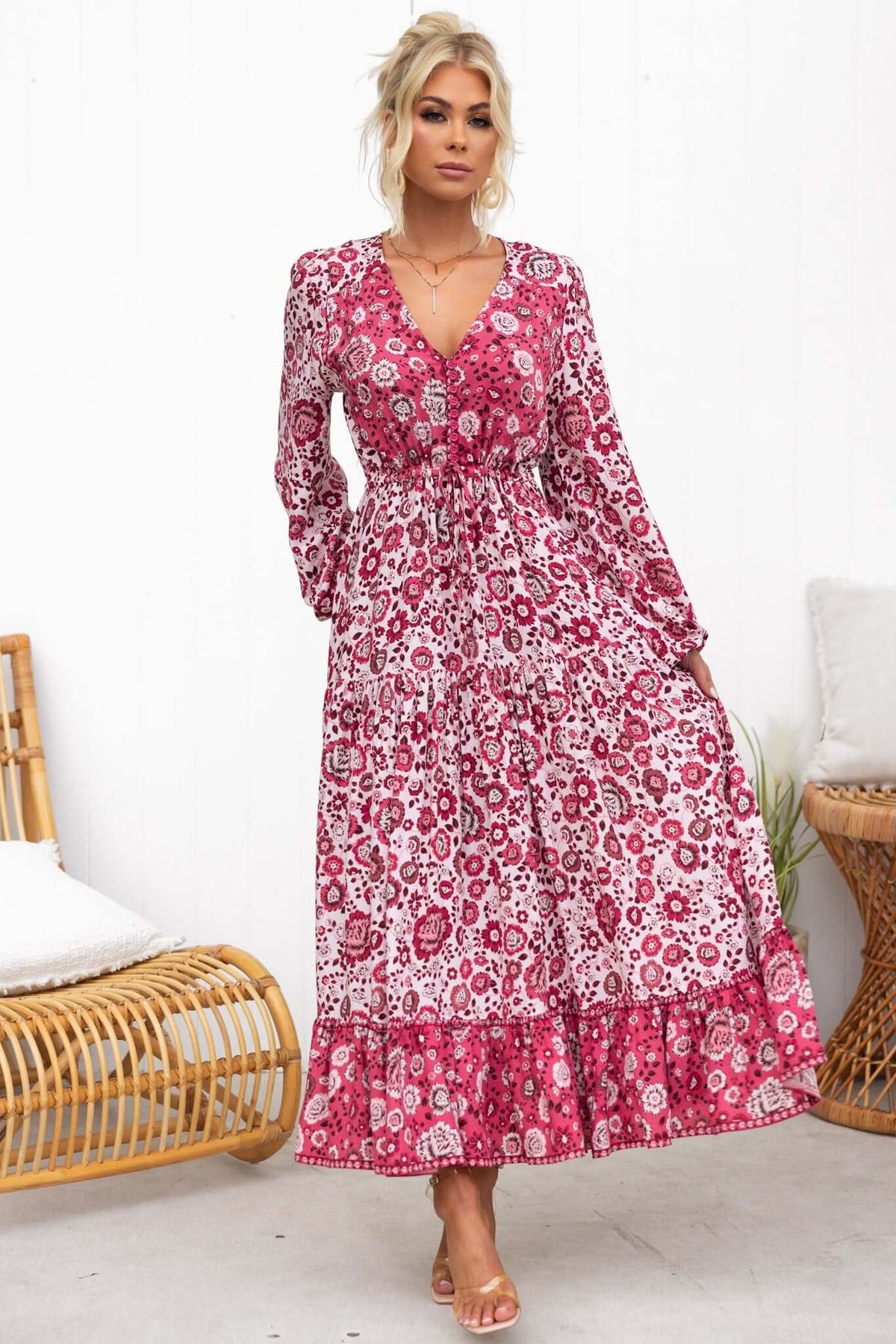 Sarzana Maxi Dress in floral print featuring button-up bust, elastic sleeves, and drawstring waist.