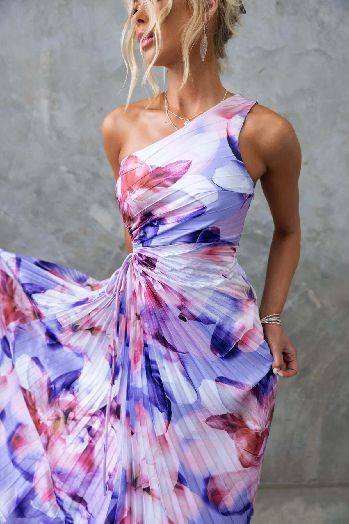 Ottile Maxi Dress features a floral print, one-shoulder neckline, and elegant pleated design, perfect for special occasions.