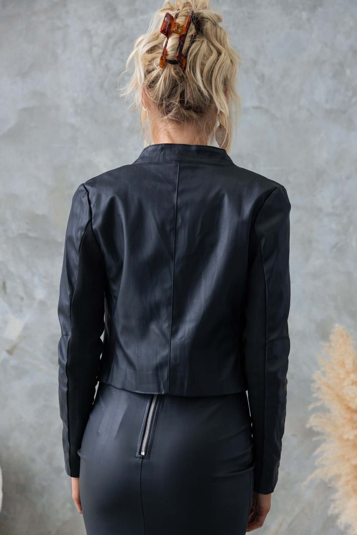Back view of a black faux leather Udine Blazer, showcasing its fitted design and stylish silhouette.