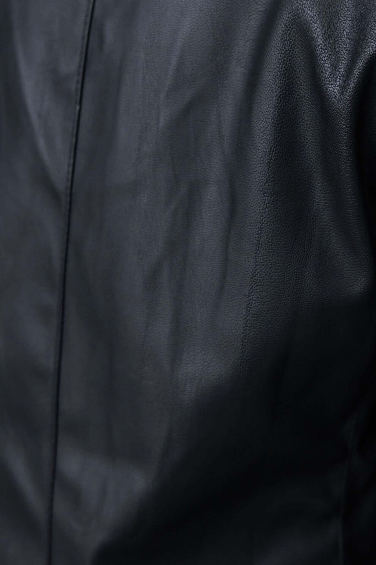 Close-up of a black faux leather Udine Blazer showcasing its textured material and tailored design.
