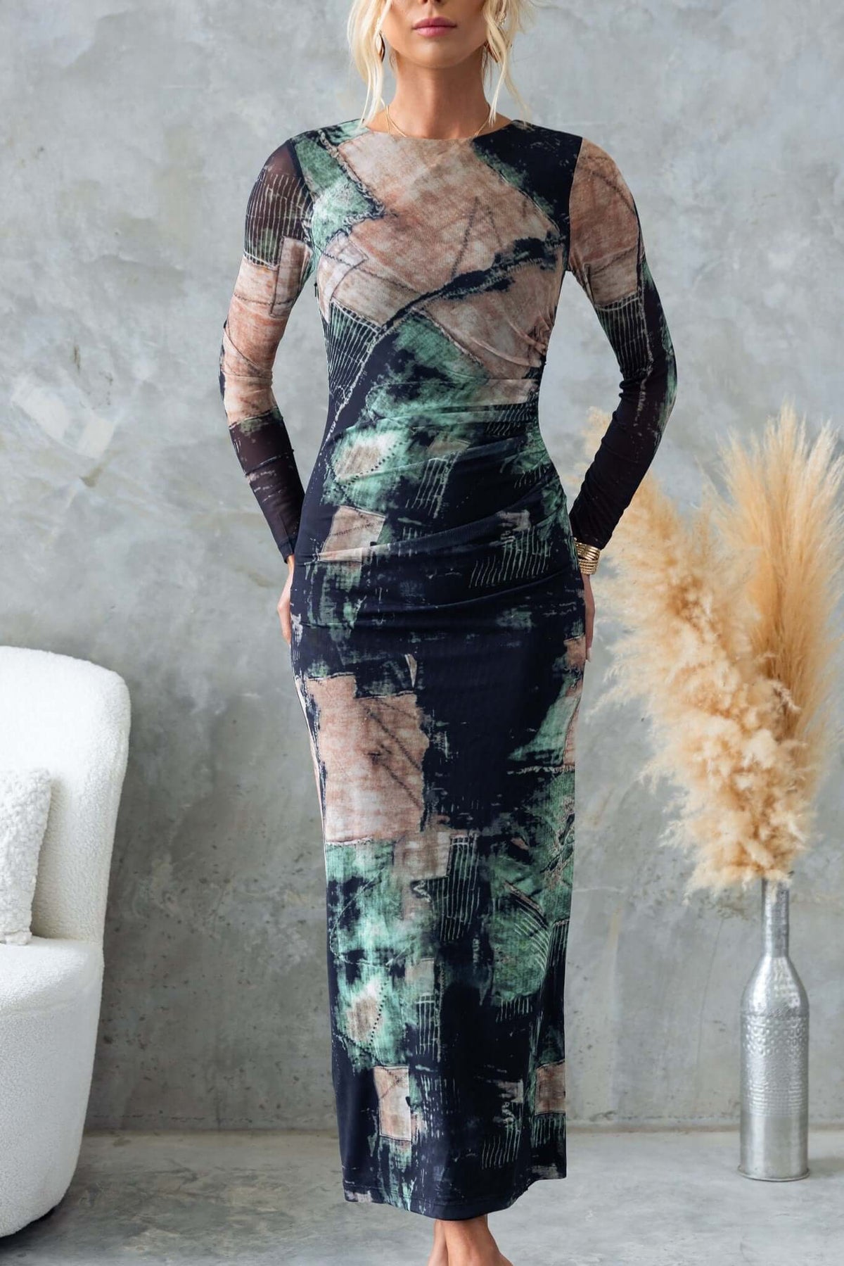 Mystique Maxi Dress in abstract black and green pattern, featuring long sleeves and a fitted silhouette.
