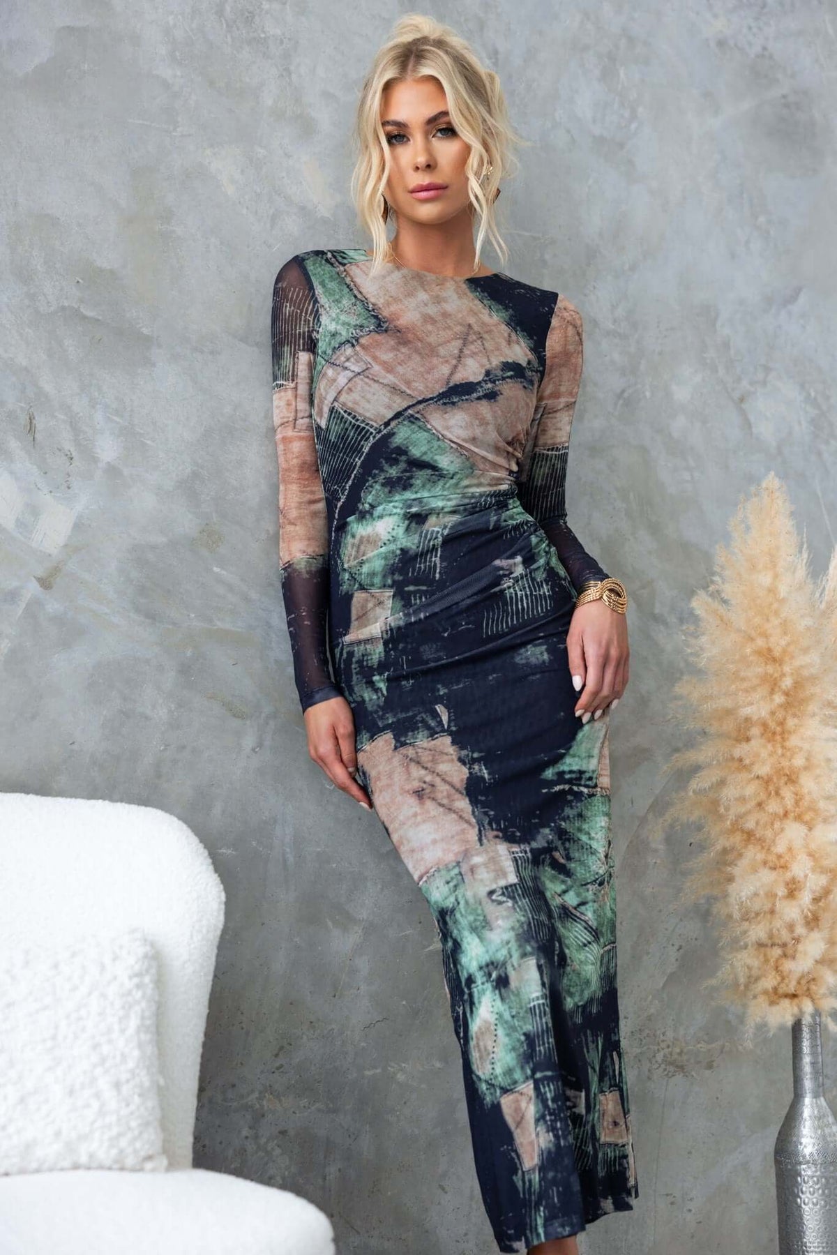 Mystique Maxi Dress featuring a unique print, long sleeves, and a stylish fit, ideal for modern fashion enthusiasts.