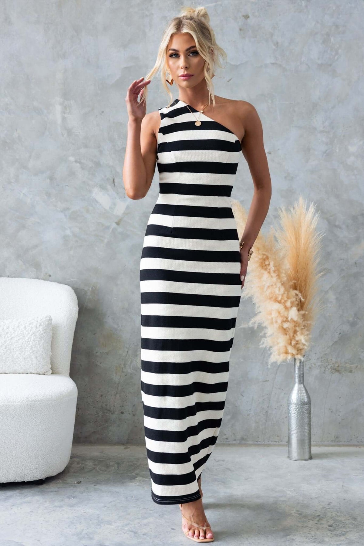 Caserta Maxi Dress featuring a one-shoulder neckline and textured striped design, perfect for stylish summer outings.