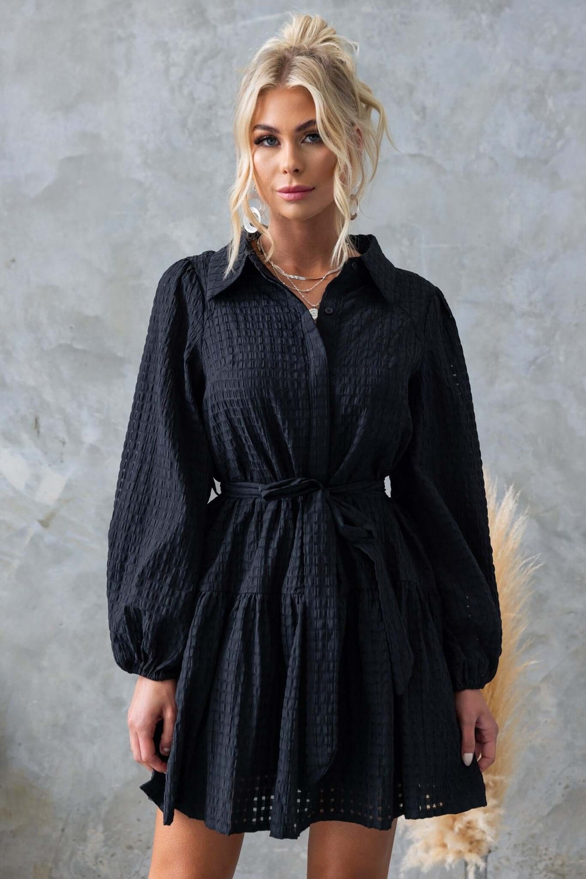 Stylish black Cottee Dress featuring a collar, button-up front, and removable tie, perfect for any occasion.