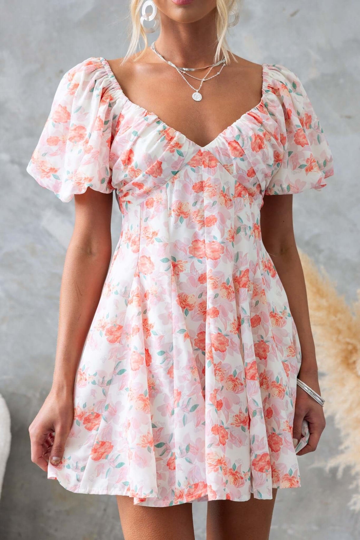Light floral Feel Good Dress with puff sleeves and a tie-back, perfect for summer wear.
