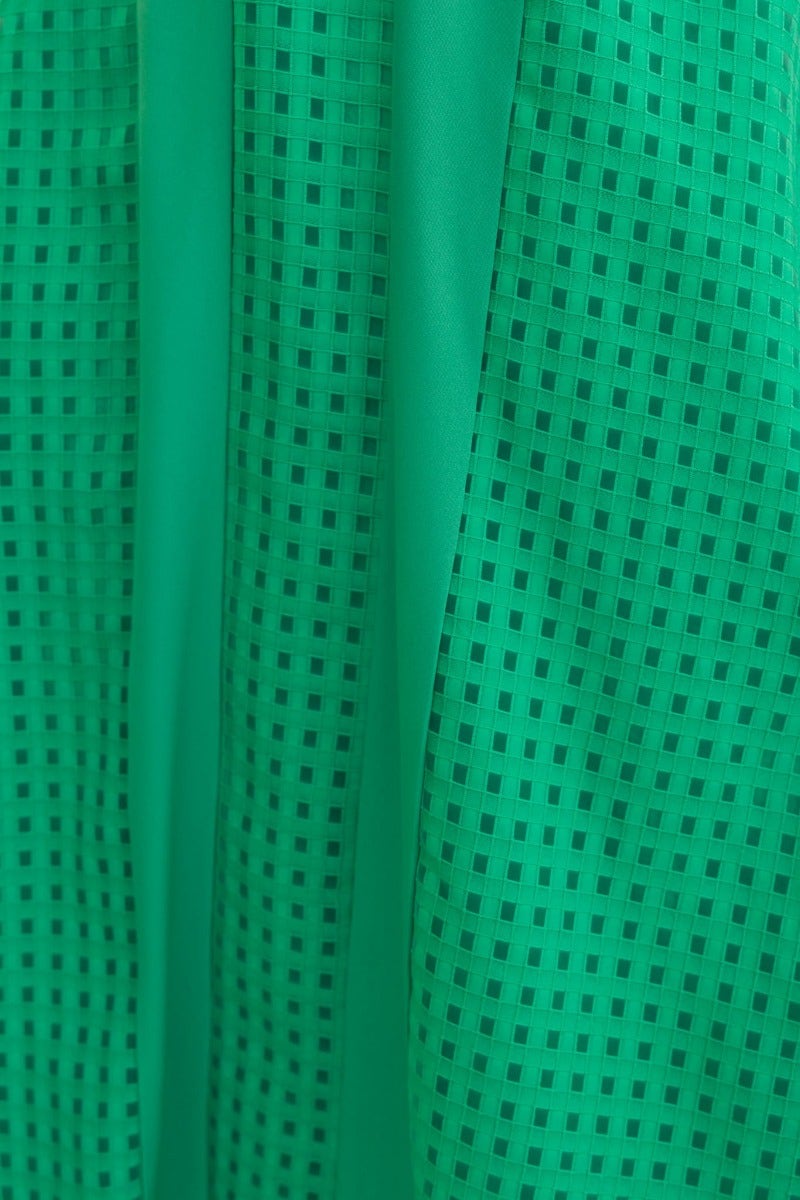Close-up of textured green material with a checked pattern, ideal for the Tamzin Maxi Dress.