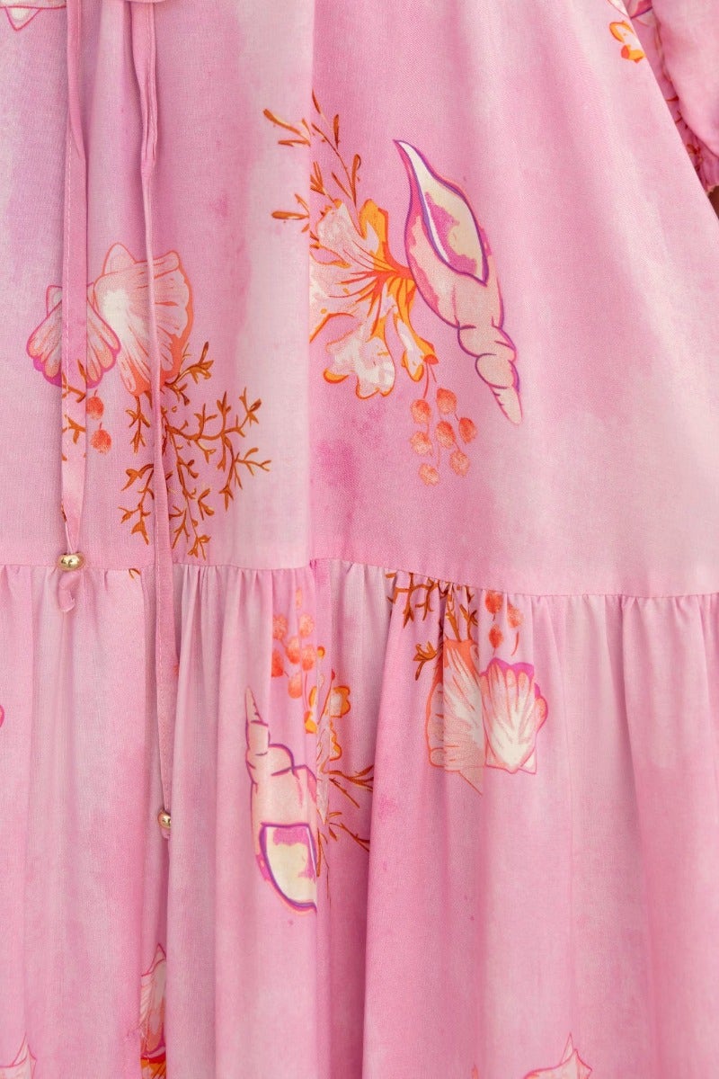 Floral print detail on Yespia Maxi Dress featuring pink hues and decorative design elements.