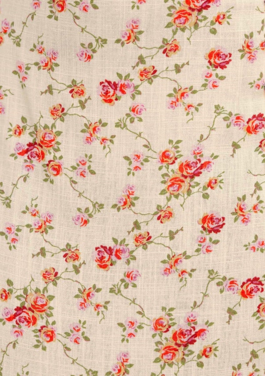 Floral fabric pattern featuring pink and red roses on a beige linen blend background.